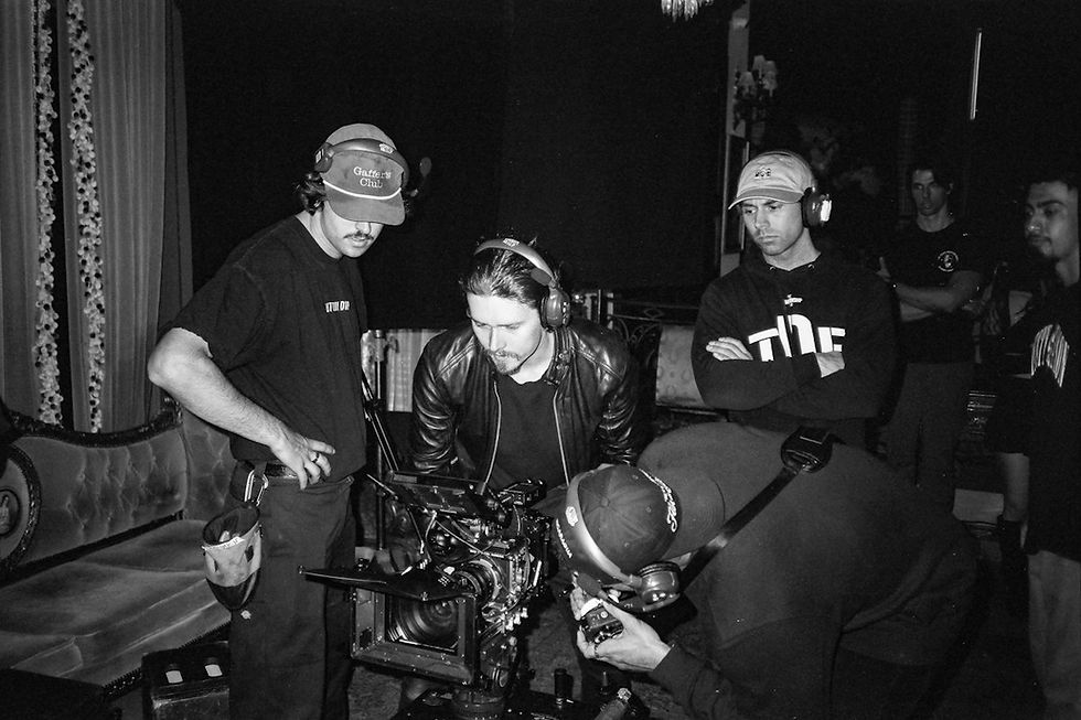Film crew reviewing a movie scene during production