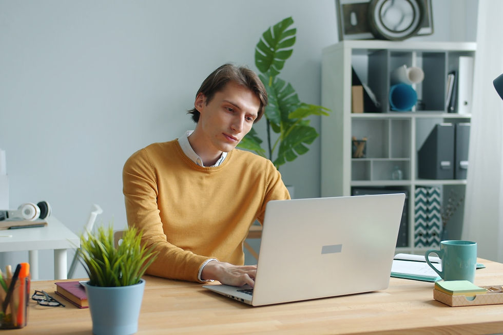Office worker managing digital fatigue at a laptop