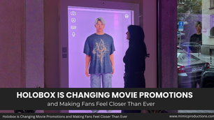 A person interacts with a hologram display indoors, featuring a man in a graphic tee. Text reads: "Holobox is Changing Movie Promotions."