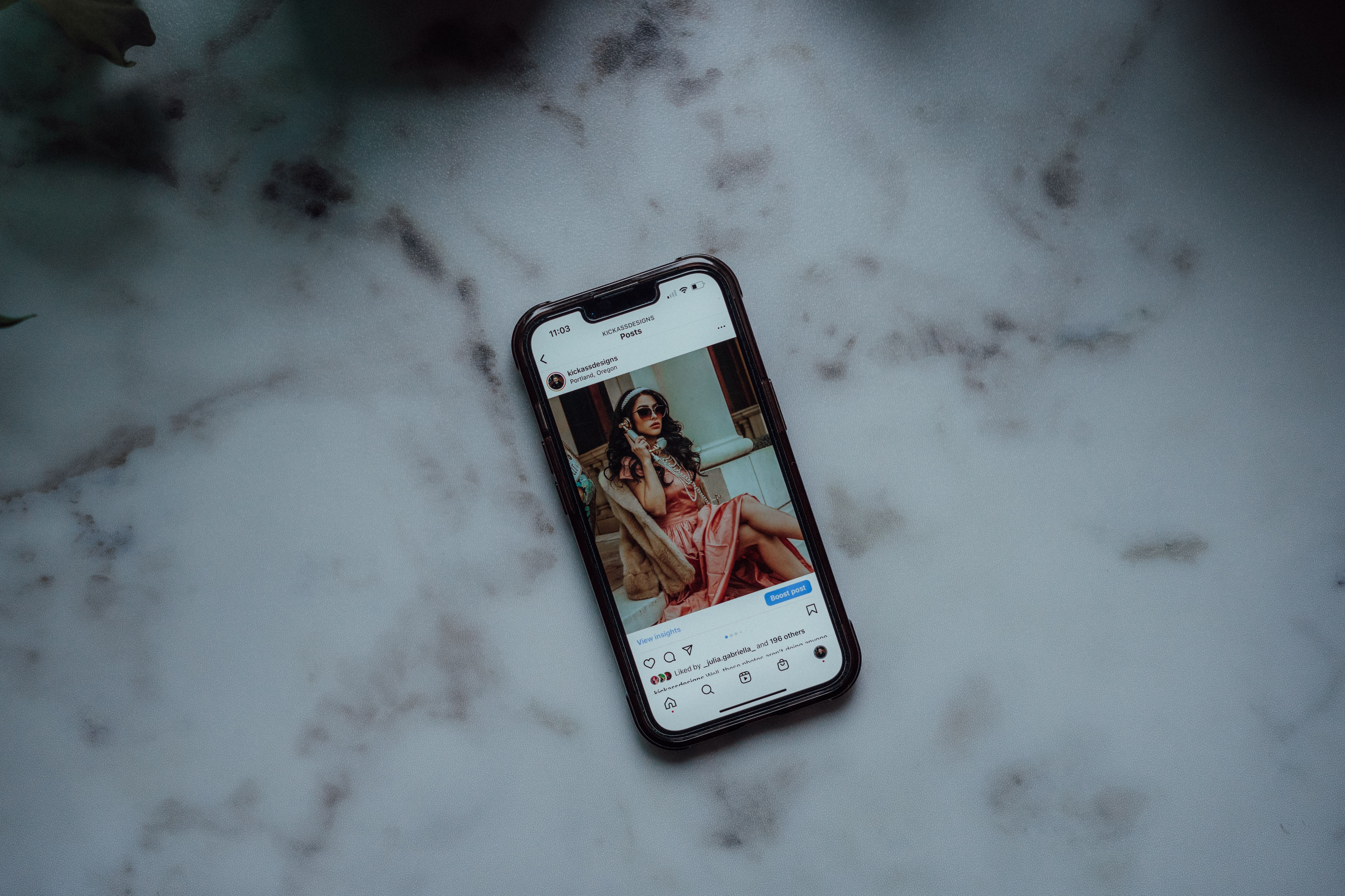 Smartphone displaying social media content for channel-specific 3D advertising
