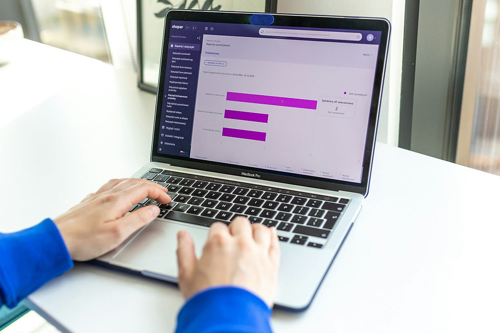 Ecommerce manager reviewing a digital retail experience on a laptop