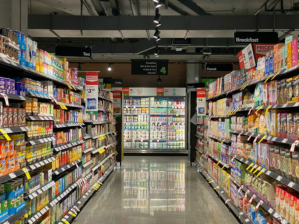 Fully stocked retail aisle representing in-store retail media inventory and shopper decision moments