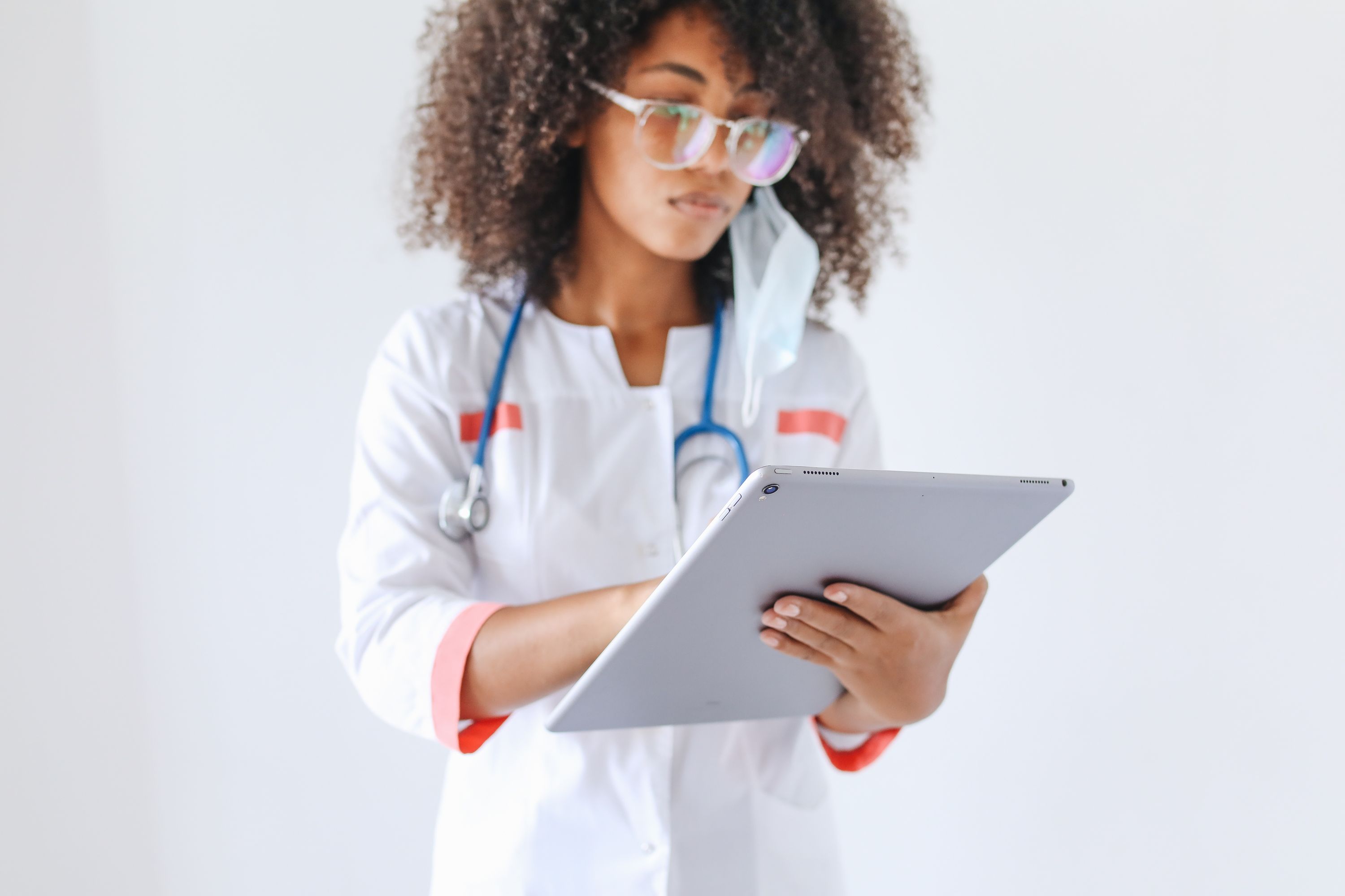 Doctor using a tablet as part of a digital healthcare learning journey