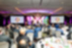 Conference keynote speaker presenting at corporate event in New Orleans photographed by event photog