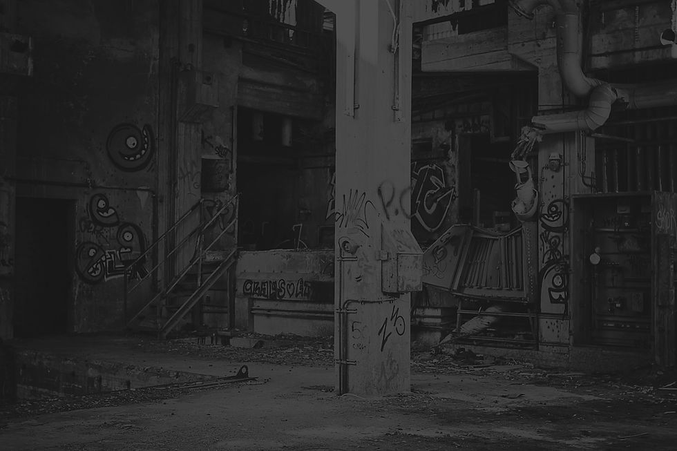 building with white concrete post beside blue machine_edited.jpg