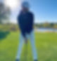 Golfer standing over a tee shot ready to hit