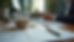 Eye-level view of a cluttered desk with a half-empty coffee cup and scattered notes