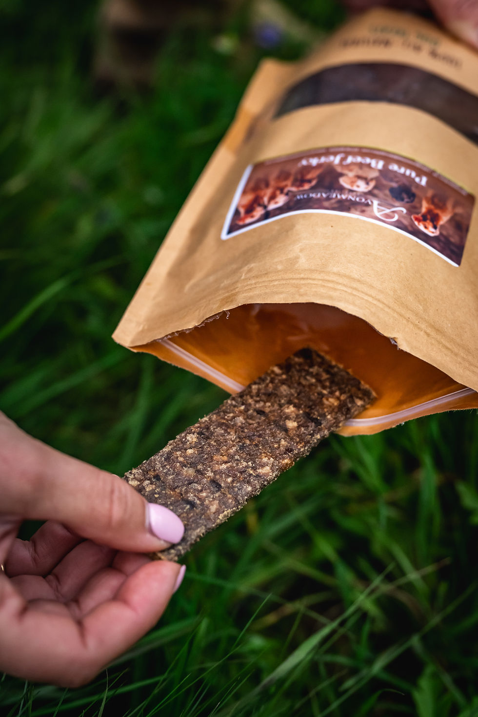Thumbnail: Lady pulling jerky strip out of bag