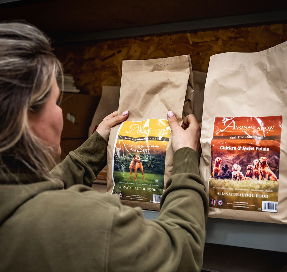 Women picking dog food bag from the shelf
