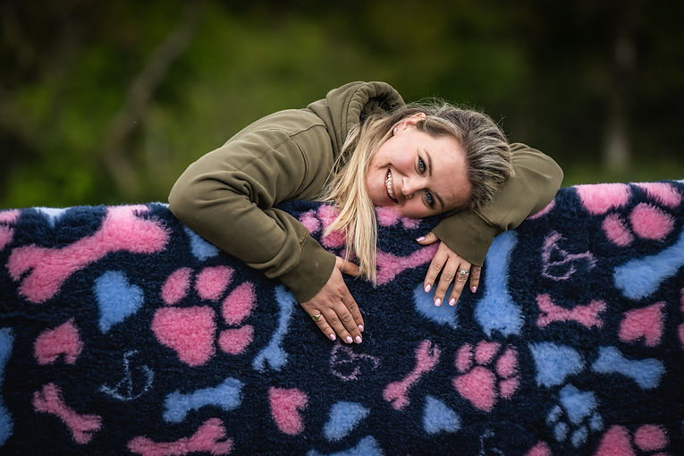 Women smiling hugging some vet bedding