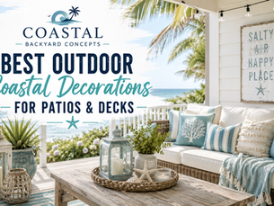 Coastal patio decorated with blue and white outdoor pillows, woven lanterns, ceramic planters, a natural fiber rug, and comfortable wicker seating overlooking the water.