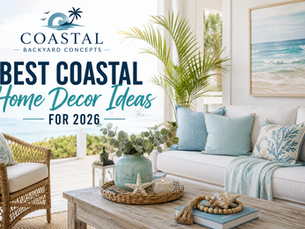 Bright coastal-inspired living room with white furniture, blue accent pillows, woven décor, natural wood finishes, and ocean-inspired artwork.