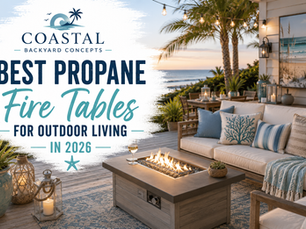 Modern propane fire table with a cozy outdoor sectional on a bright coastal patio overlooking the water, creating a warm and inviting backyard gathering space.