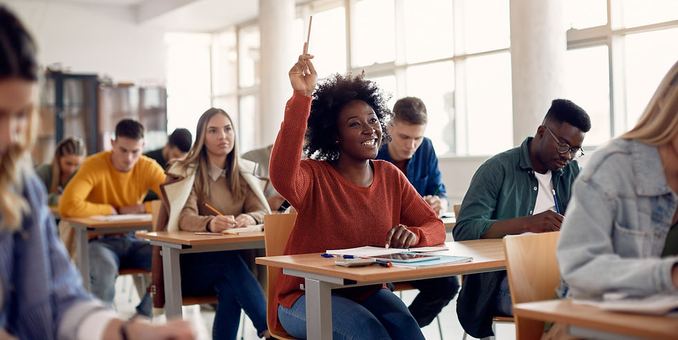 Happy African American student raising her hand to ask a question during lecture in the cl