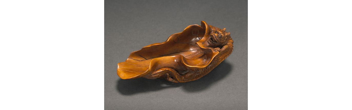 A CARVED BOXWOOD LOTUS LEAF