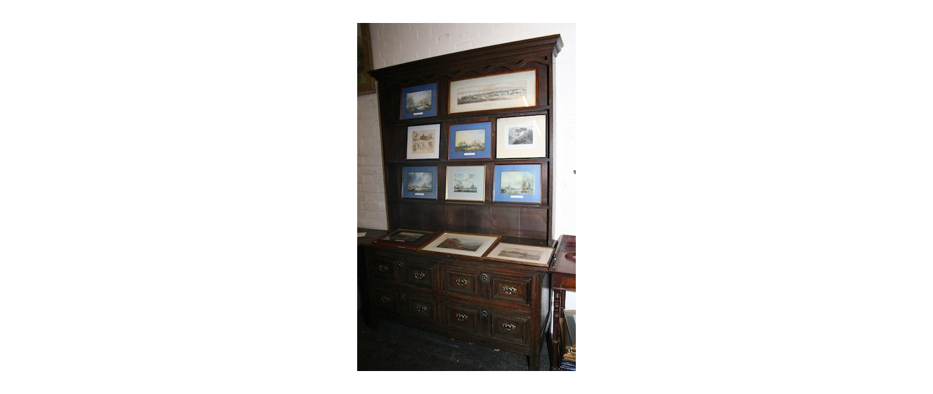 AN ADAPTED LATE 17TH CENTURY DRESSER WITH LATER RACK