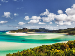 Calm tropical inlet with white sand and turquoise water, representing restoration, reflection, and sustainable professional development for psychologists.