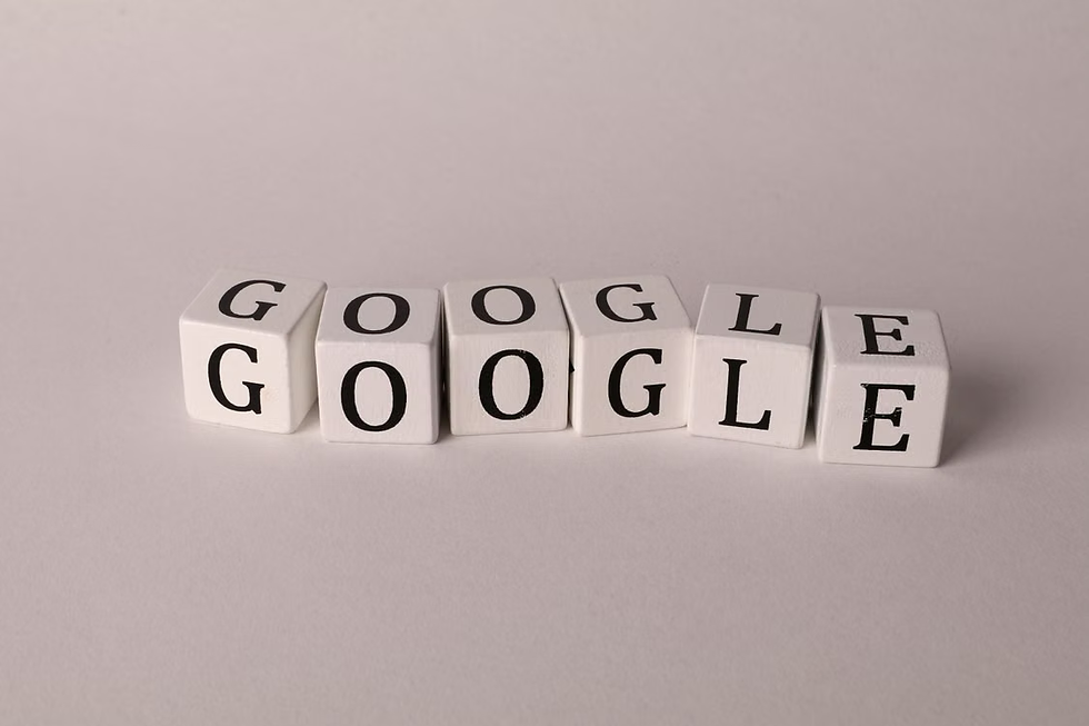 White cubes spelling GOOGLE on a plain light background, creating a clean minimalist look.