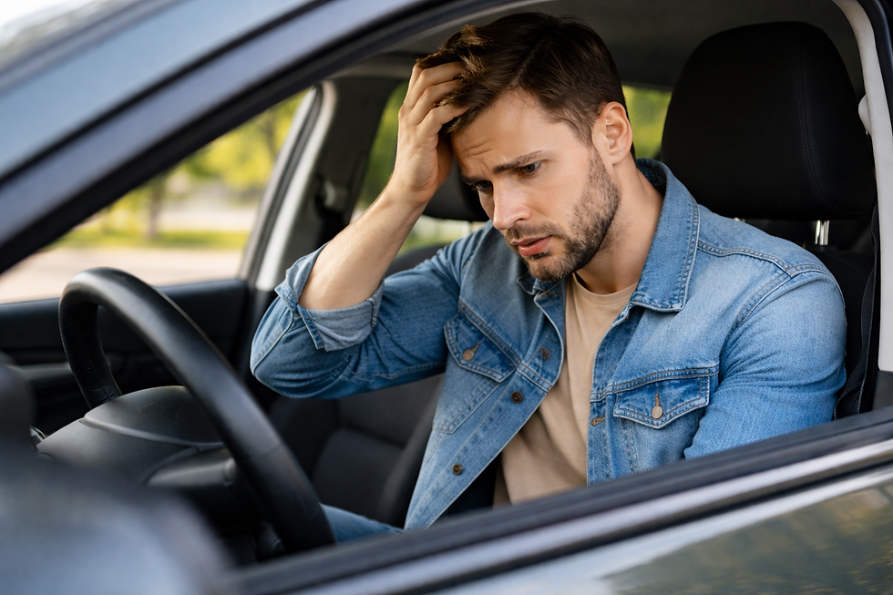 Man who is stressed because he car won't start. Roadside assistance