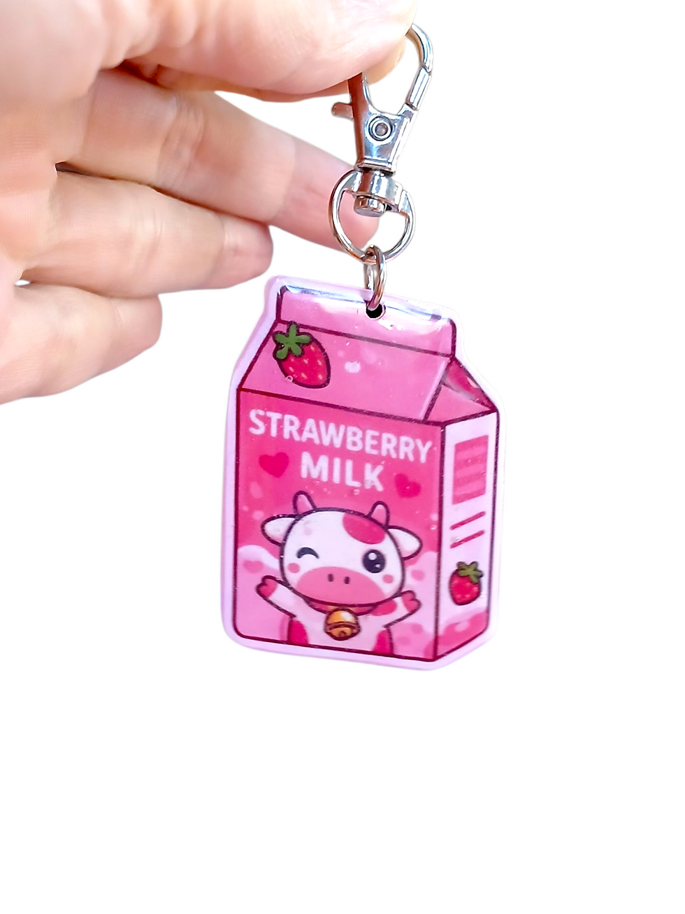 Thumbnail: white background showing details of strawberry milk keychain