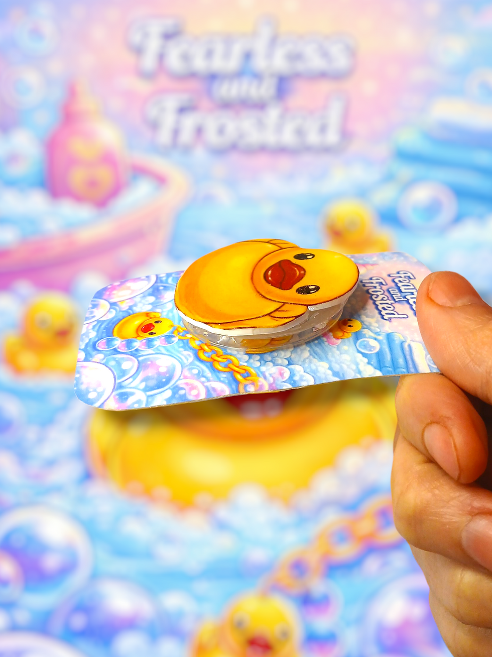 Thumbnail: showing the rubber ducky laying down flat on the backing card it comes on
