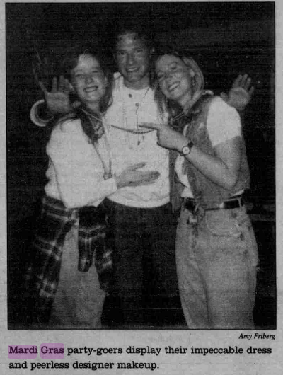 Three students smile for the camera at a 1996 Mardi Gras party. Photo courtesy of Amy Friberg.