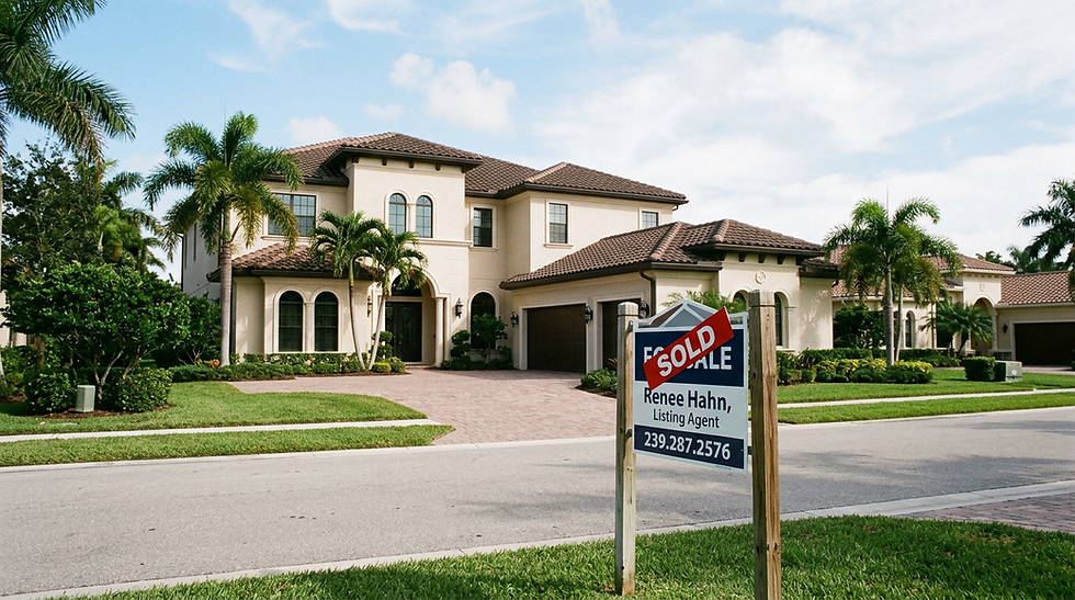 Image of a luxury naples home with sold sign in the yard.