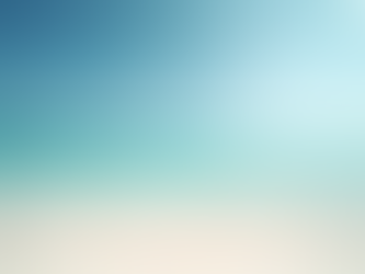 Eye-level view of a beach club pool area with lounge chairs and umbrellas