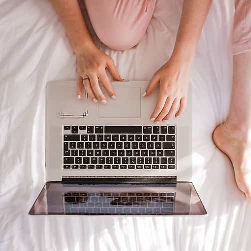 Woman booking hypnosis / coaching sessions online