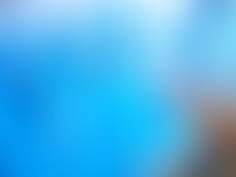 Blue plastic bottles on a shelf with someone picking one up.