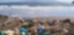 Plastic waste litters the shoreline, highlighting the urgent need to address the recycling crisis.