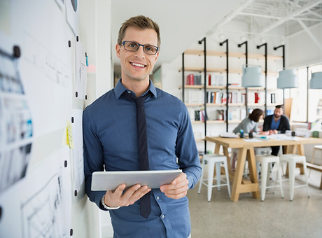 Professional Man Holding a Tablet