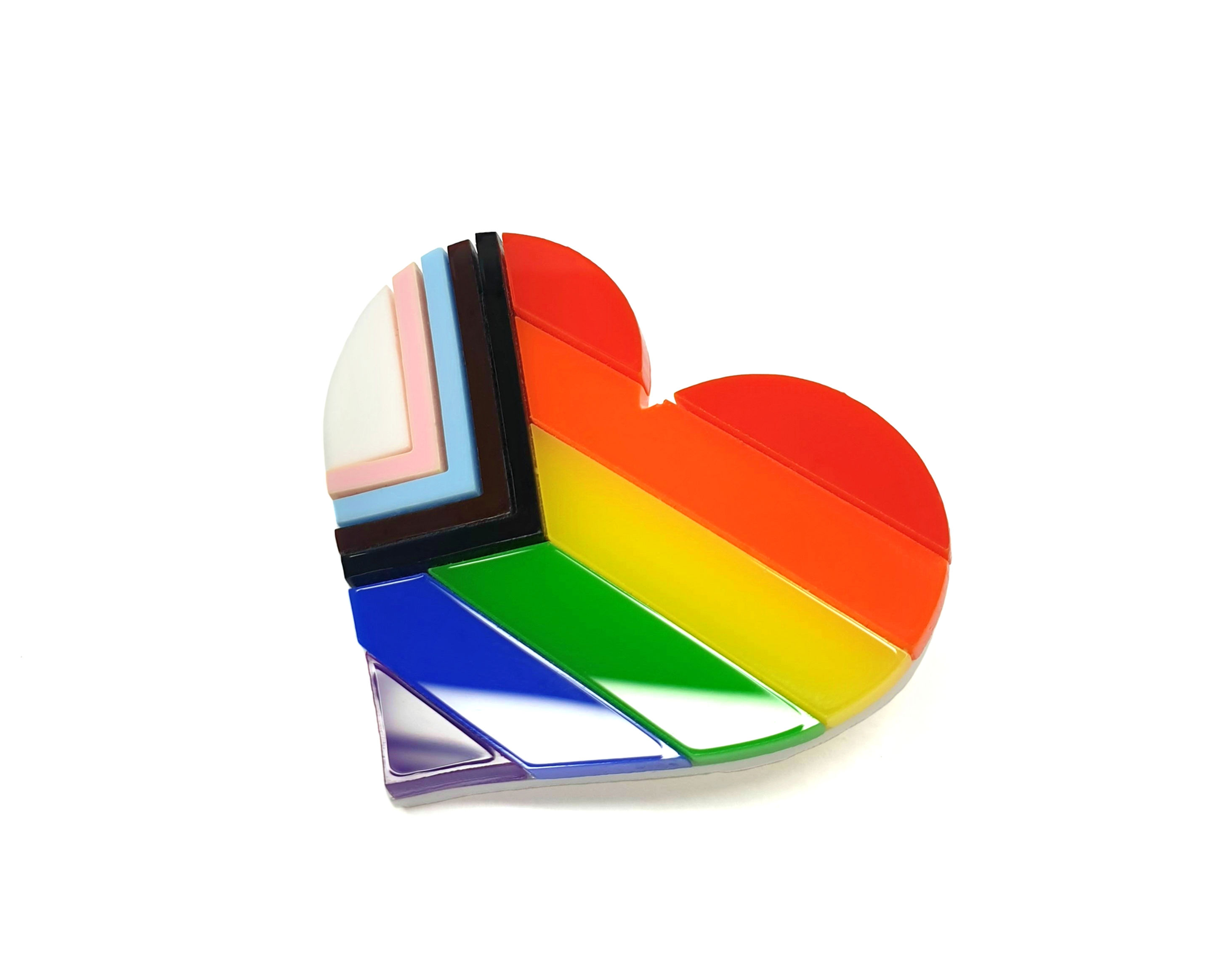 The progress pride heart brooch on a white background