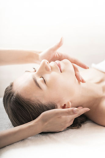 young-woman-having-her-head-massaged-beauty-salon.jpg