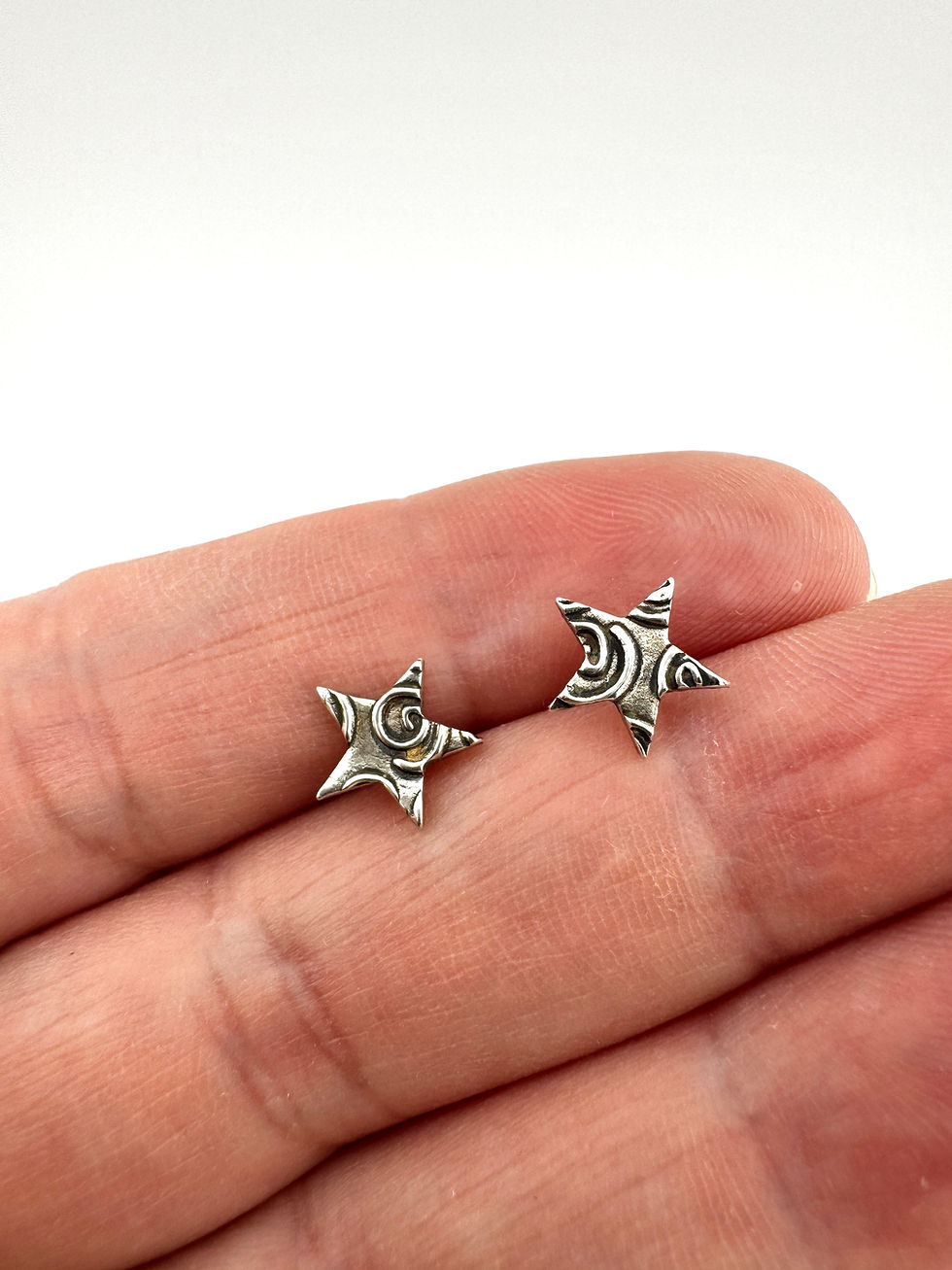 Swirly star studs