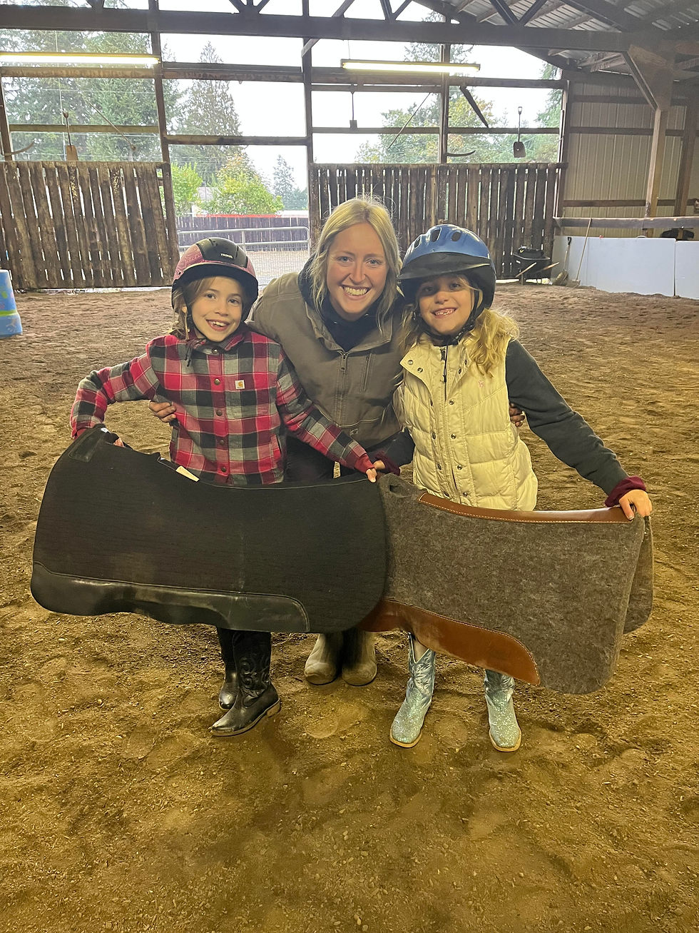 Instructor Kristin with two riders after their ride.