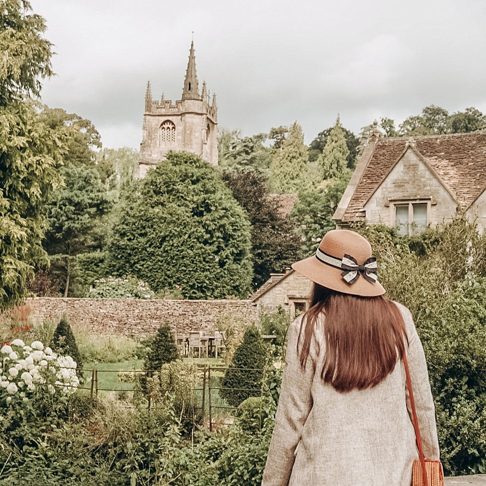 View of St. Andrew's Church in Castle Combe from Bybrook River bridge