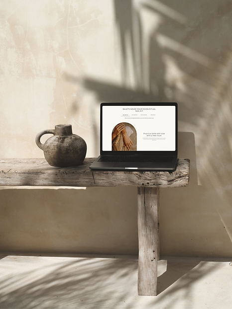 website design displayed on a laptop with boho background.png