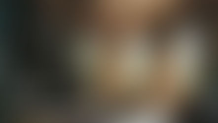 Abandoned mansion interior with staircase, chandelier, sunlight through broken windows, and a mysterious haunted atmosphere.