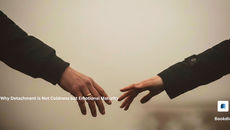 Two hands reaching toward each other but not touching, symbolizing emotional distance.
