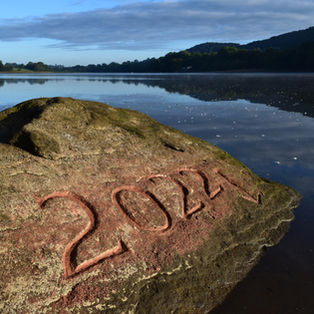 site specific artwork, carving on a stone at low water mark during a drought