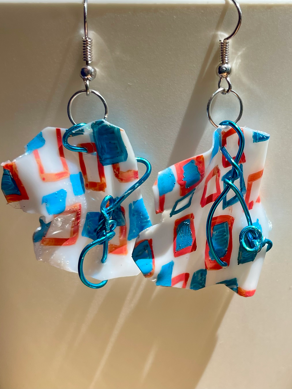 Thumbnail: geometric recycled handmade blue red wire earrings