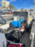 Mechanic Danny in the engine compartment of a boat