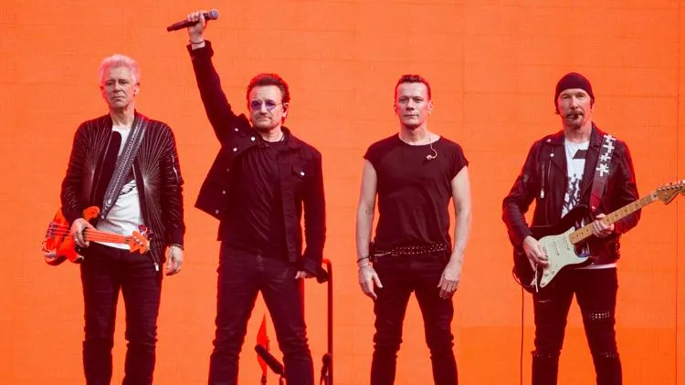 Article illustration: U2 to Headline Netflix's First NFL Thanksgiving Eve Halftime Show.