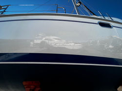 Mirror-finish hull gelcoat after GlideCoat Pro wax job, ESI Anacortes shipyard