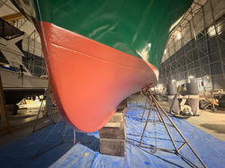 Fresh red antifouling bottom paint job on a sailboat hull, ESI Anacortes paint booth
