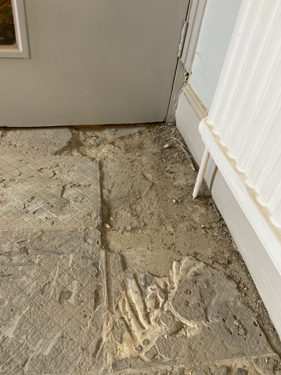 damaged flooring after tile removal
