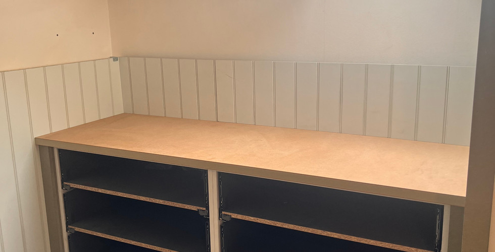 custom built drawer units made form mdf with a small section of wall panelling 