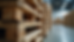 Close-up view of sturdy wooden pallets stacked in a warehouse