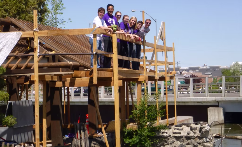 Several BYU-I students help with the pavilion.  Some cut rough-sawn 4X4s into full dimension 2X2 inch boards for the ceiling.  Some worked at soil sculpting (digging dirt) in preparation for the patio that will extend out into the river.  When digging dirt involves levels, straight edges and three types of shovels, you can call it sculpting.  Several other students helped with the incredible Japanese garden the pavilion is located in. 